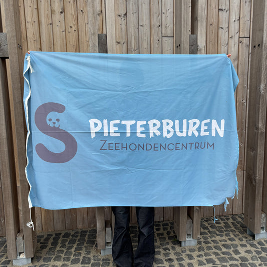 87. Light blue flag featuring the logo of the Seal Centre (used)